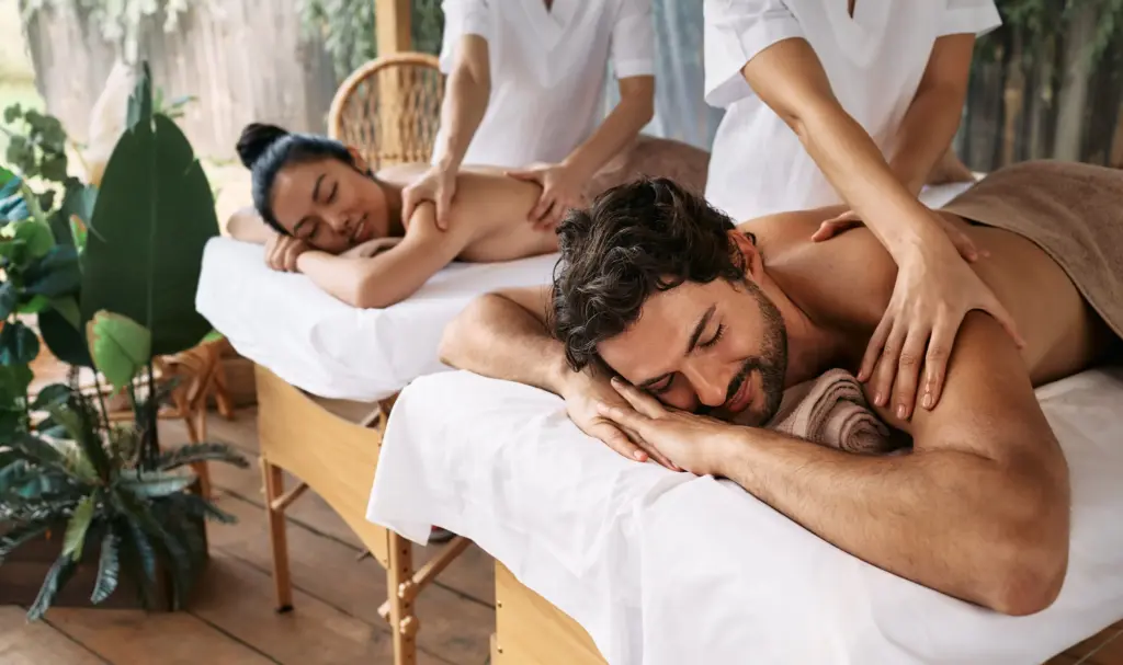 "Couple enjoying a relaxing couples massage in Bali spa during a 7-day romantic itinerary "
