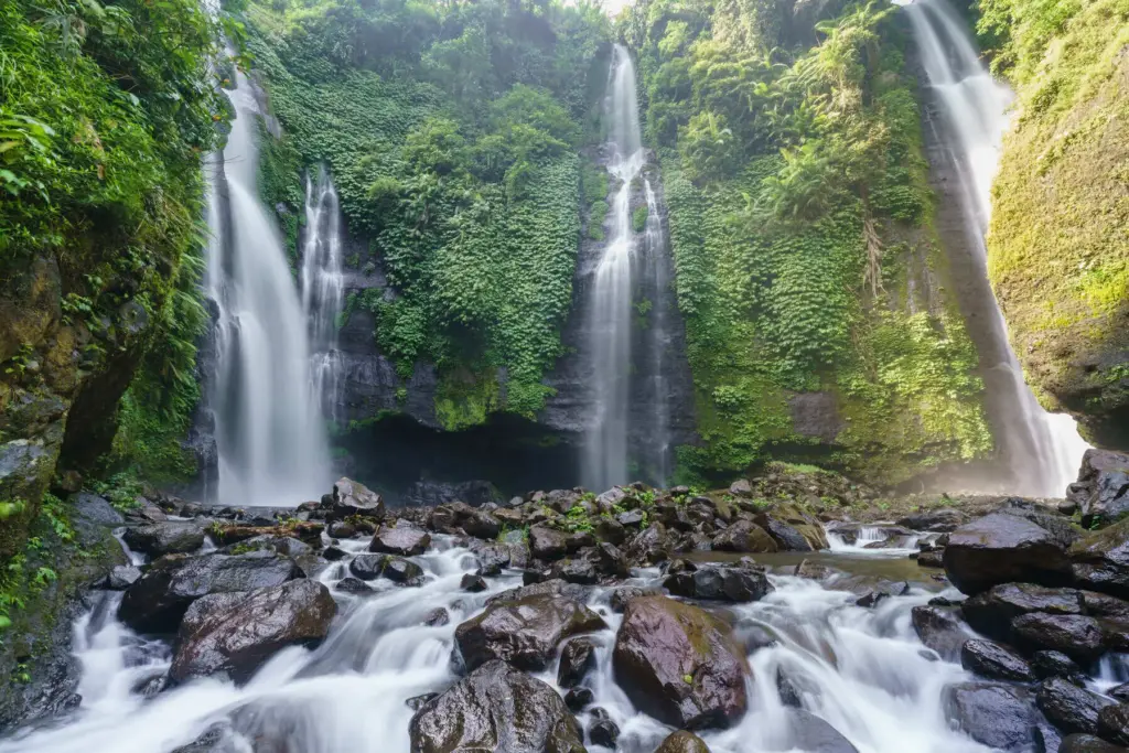Sekumpul Waterfall in North Bali surrounded by lush jungle, one of the most beautiful Bali waterfalls