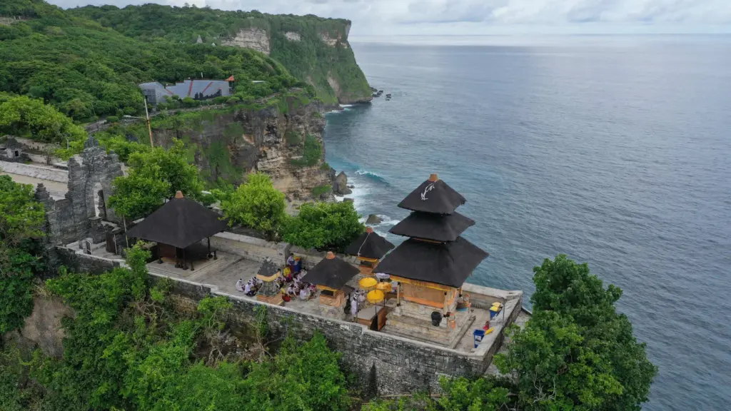 Aerial view of Uluwatu Temple Bali perched on a cliff above the Indian Ocean